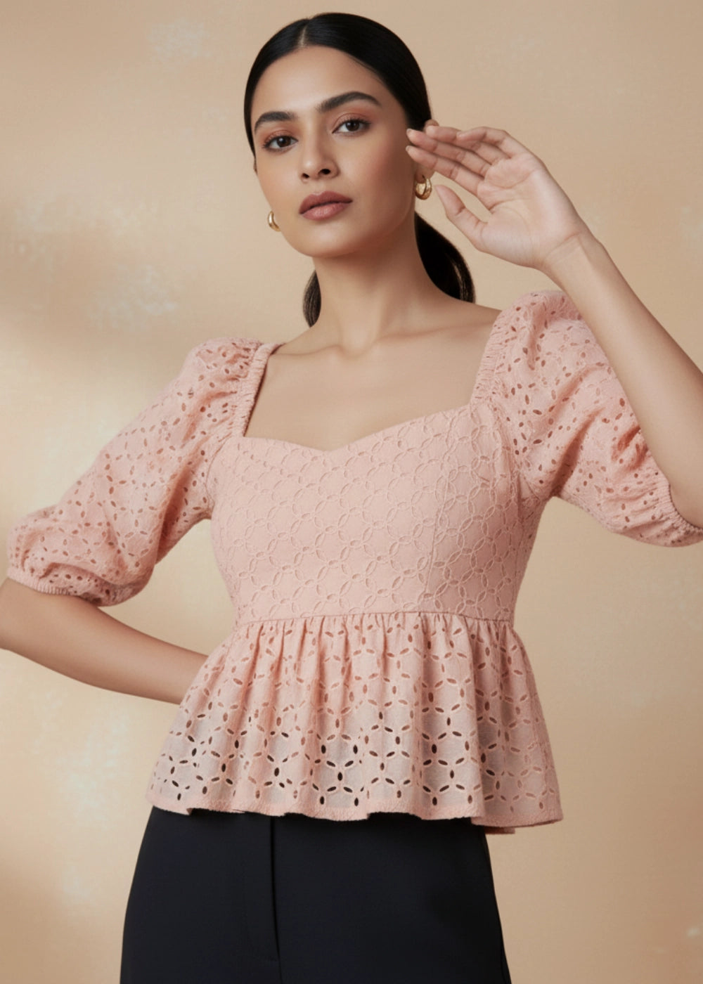 Model wearing Karee’s Peach Blossom Lace Dream Blouse — 100% cotton peach lace top with puff sleeves, sweetheart neckline, peplum hem, and smocked back for comfort and sustainable elegance.
